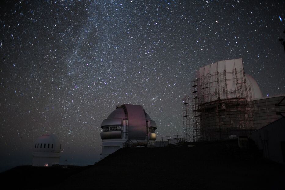 Mauna Kea Observatory, Waimea, United States, with stars in the background